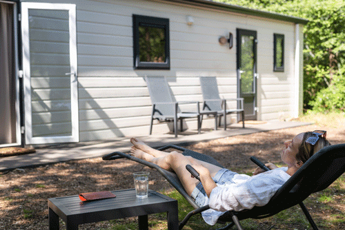 woman-relaxing-sun-lounger-suburb-summer-suburb